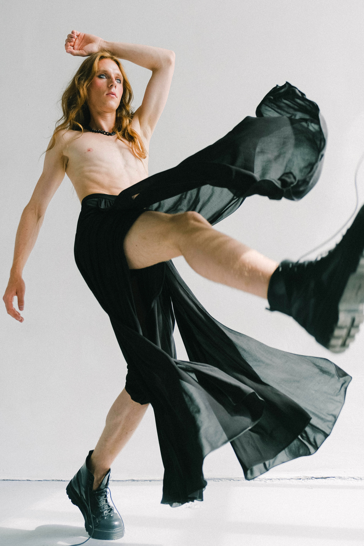 Studio Shot of Man Wearing Black Boots